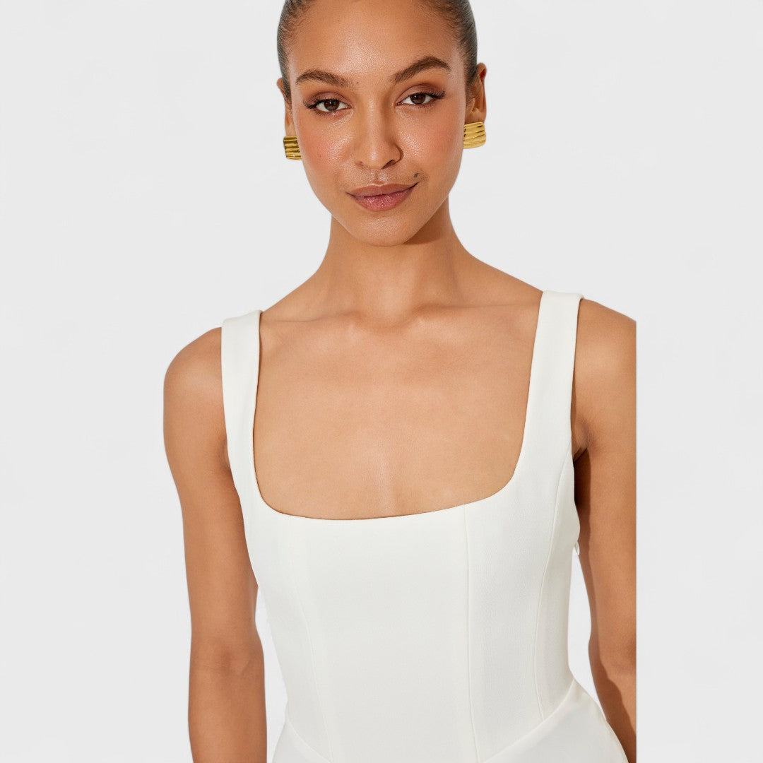 Amelia – A midi dress featuring a fluid, timeless silhouette